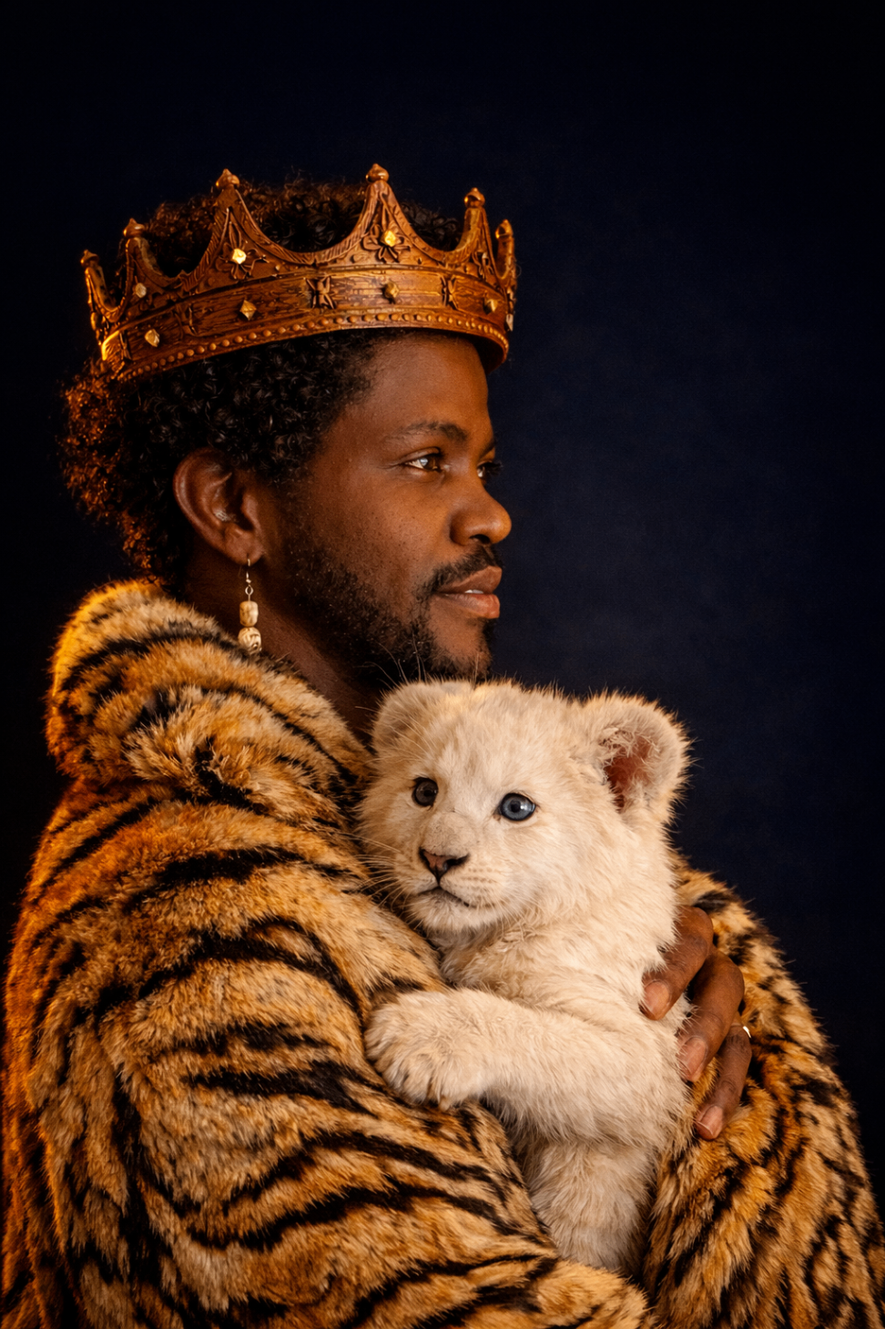 Editorial portrait — crown and lion cub